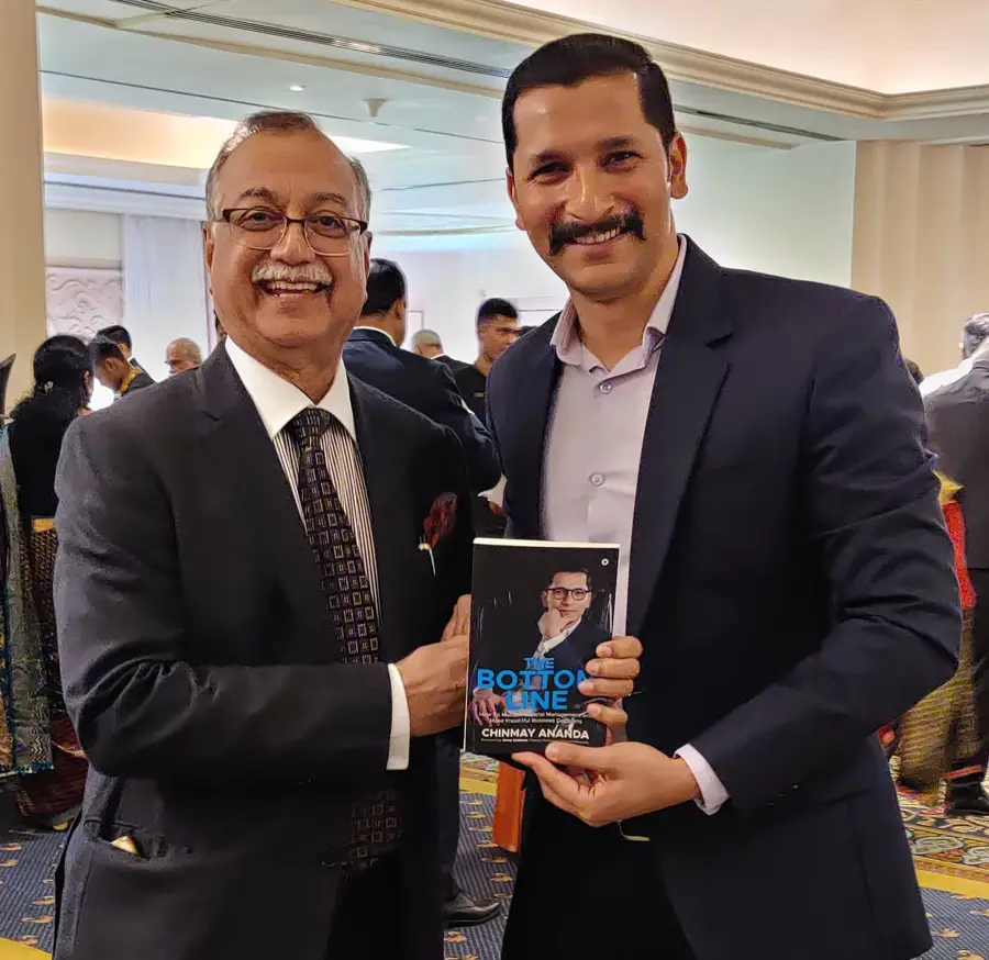 Dr. H. Sudarshan Ballal, Chairman, Manipal Hospitals with Chinmay Ananda's book