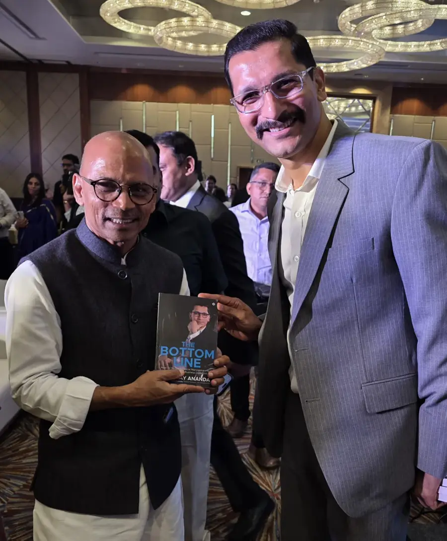 Dr. Sharanaprakash Patil, Minister for Medical Education, Government of Karnataka with Chinmay Ananda's book