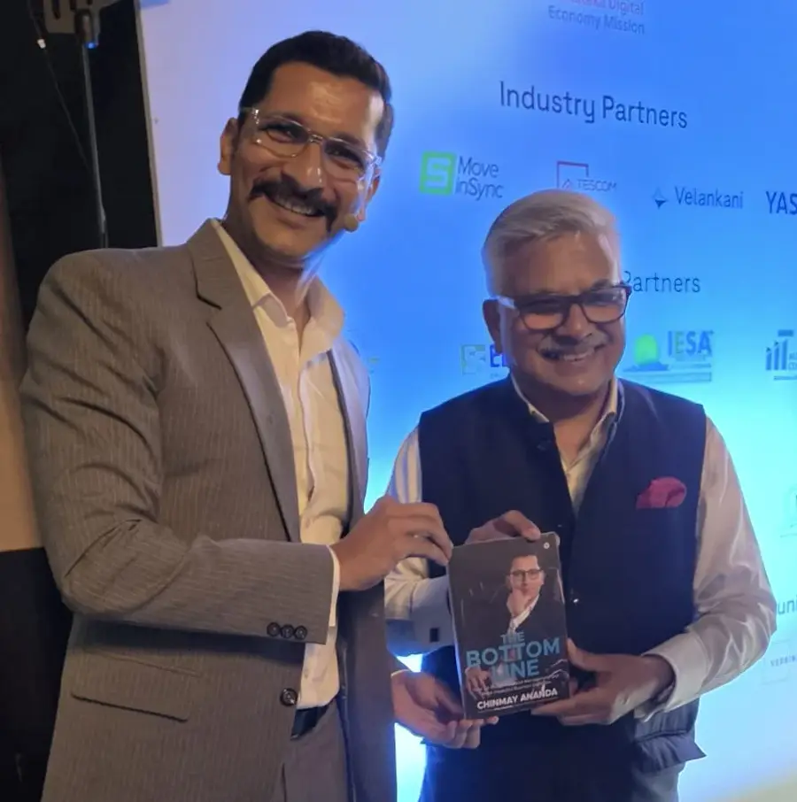Kamal Bali, MD Volvo Group India with Chinmay Ananda's book