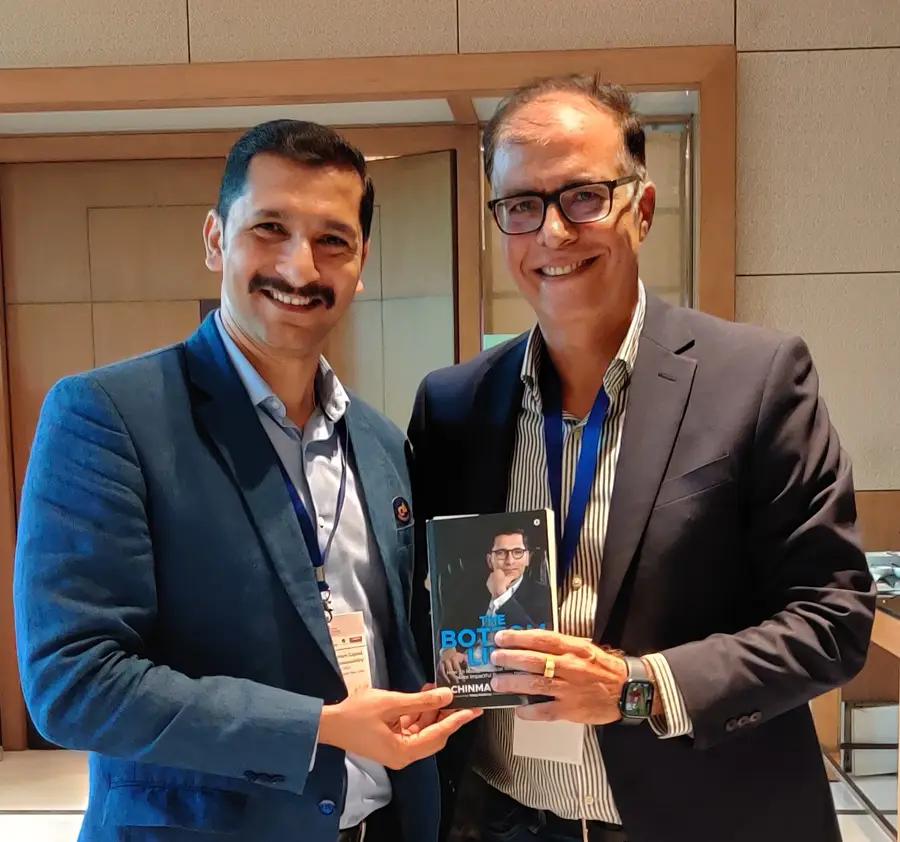 Rajeev Chaba, MD, JSW MG Motor India with Chinmay Ananda's book