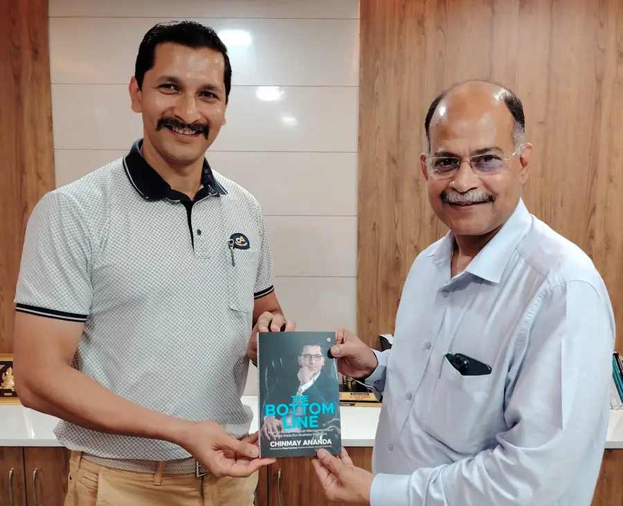 Ullas Kamath, Founder, UK & Co with Chinmay Ananda's book