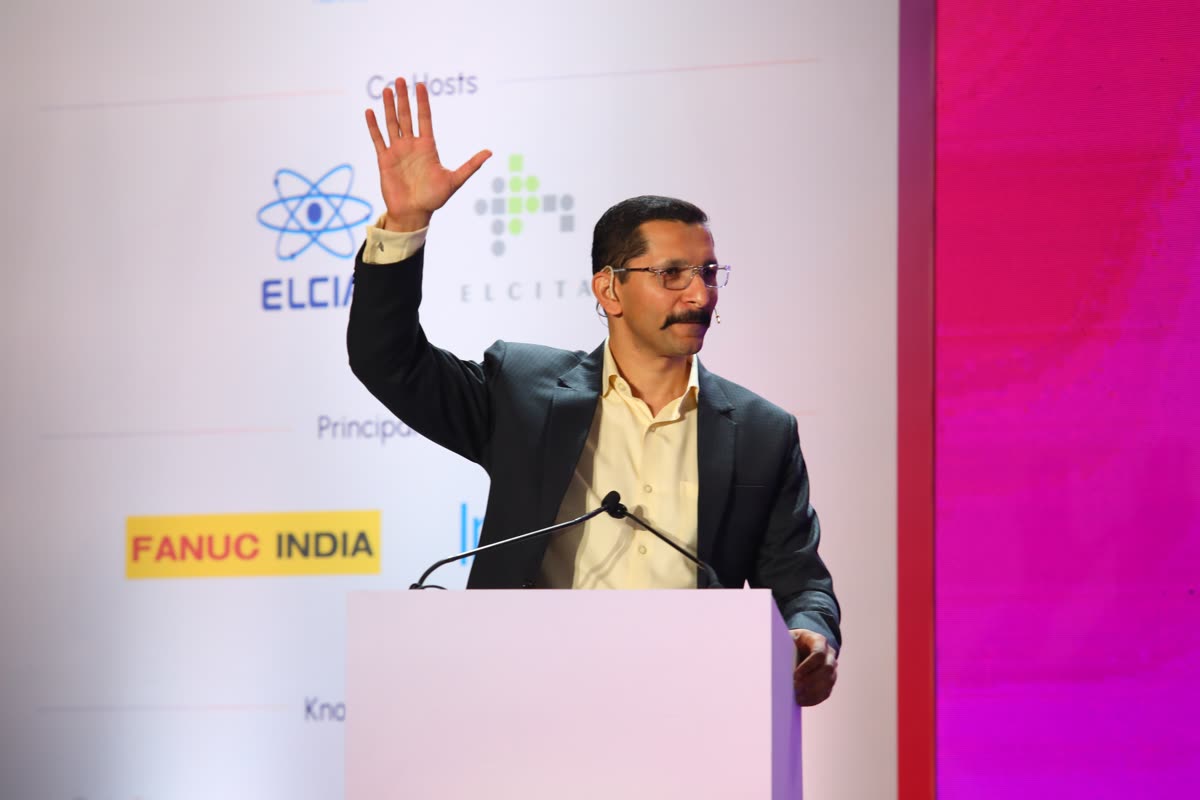Chinmay at the podium of the ELCIA Tech Summit