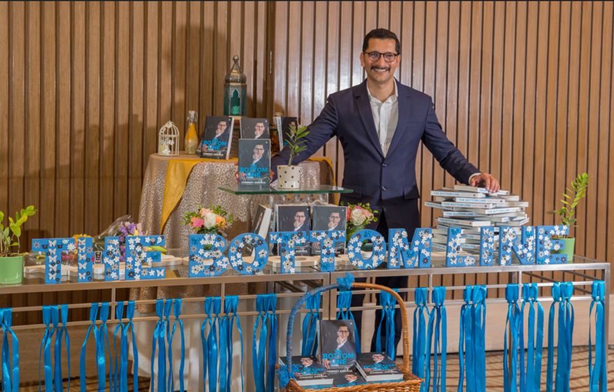 Chinmay at the launch display for his book The Bottom Line