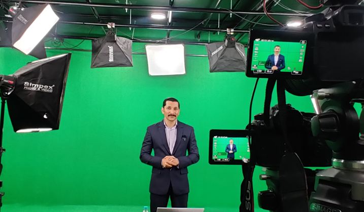 Chinmay presenting in a studio while recording an online course